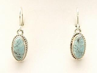 Genuine Number 8 Mine Turquoise Stones set in Sterling Silver French Wire Earrings. The Number 8 mine is located in Eureka County Nevada. Since 1976 there has been no Number 8 Turquoise mined. There is however, an existing stock pile that Mr. Dowell Ward, the last owner of the Number 8 mine, had stocked away for later sorting. The Turquoise is a collector's item--because once the reserve is gone there will be no more material released onto the market. The Gold Mining Company owns the claim to the Number 8 mine and it has been swallowed up by the gold mining operations. This is some of the last Number 8 Turquoise to be had and will be a great addition to your collection. Created by Navajo Artist Bobby Piaso. Signed.