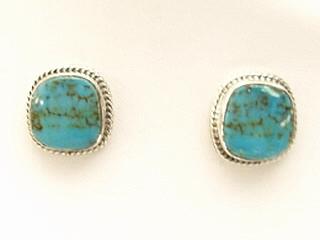 Genuine Turquoise Mountain Mine Turquoise set in Sterling Silver Post Earrings. The Turquoise Mountain Mine is located in the Mineral Park Mining District, Mohave County, Arizona. Although Turquoise Mountain is located near the Kingman Turquoise Mine it is considered a classic mine in its own right because the Turquoise is so different in appearance. It is also known as 