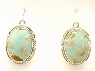 Genuine Number 8 Mine Turquoise Stones set in Sterling Silver French Wire Earrings. The Number 8 mine is located in Eureka County Nevada. Since 1976 there has been no Number 8 Turquoise mined. There is however, an existing stock pile that Mr. Dowell Ward, the last owner of the Number 8 mine, had stocked away for later sorting. The Turquoise is a collector's item--because once the reserve is gone there will be no more material released onto the market. The Gold Mining Company owns the claim to the Number 8 mine and it has been swallowed up by the gold mining operations. This is some of the last Number 8 Turquoise to be had and will be a great addition to your collection. Created by Navajo Artist Emerson Delgarito. Signed.