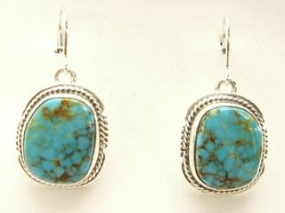 Genuine Turquoise Mountain Mine Turquoise set in Sterling Silver French Wire Earrings. The Turquoise Mountain Mine is located in the Mineral Park Mining District, Mohave County, Arizona. Although Turquoise Mountain is located near the Kingman Turquoise Mine it is considered a classic mine in its own right because the Turquoise is so different in appearance. It is also known as 