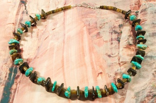 Beautiful Necklace featuring Genuine Kingman Turquoise, Penshell and Penshell Heishi. Sterling Silver Clasp. The photo is of the jewelry you will be receiving. Created by Santo Domingo Artist Carol Pacheco. The Santo Domingo Pueblo is in New Mexico, near Santa Fe. 
