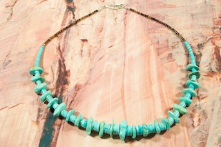 Beautiful Necklace featuring Hand Carved Genuine Sleeping Beauty Turquoise Heishi Beads and Nuggets. Penshell Heishi Accents. Sterling Silver Clasp.  Created by Santo Domingo Artist Carol Pacheco. The Santo Domingo Pueblo is in New Mexico, near Santa Fe. 