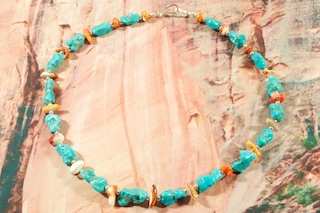 Beautiful Necklace featuring Genuine Sleeping Beauty Turquoise and Spiny Oyster Shell. Sterling Silver Beads and Clasp. Created by Santo Domingo Artist Carol Pacheco. The Santo Domingo Pueblo is in New Mexico, near Santa Fe. 
