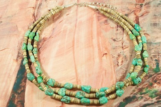 Beautiful 3 Strand Necklace featuring Genuine Kingman Turquoise and Olive Shell Heishi. Sterling Silver Extender, Cones and Clasp.  Created by Santo Domingo Artist Carol Pacheco. The Santo Domingo Pueblo is in New Mexico, near Santa Fe.