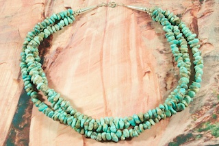 Beautiful Necklace featuring Genuine Turquoise and Spiny Oyster Shell. Stunning Spiny Oyster Shell drop representing corn. Sterling Silver Clasp. Created by Santo Domingo Artist Carol Pacheco. The Santo Domingo Pueblo is in New Mexico, near Santa Fe. 