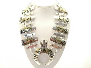 Stunning Sterling Silver Squash Blossom Necklace. Beautiful Buffalos with Heartline Design with 12K Goldfill. Created by Navajo Artist Tommy Singer.