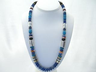 Authentic Native American Jewelry Genuine Blue Lapis Necklace with Genuine Turquoise, Spiny Oyster Shell, Black Onyx and Howlite Accents. Sterling Silver Beads and Clasp. Created by Navajo Artist Tommy Singer. Signed.