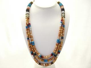 Authentic Native American Jewelry 3 Beautiful Strands of Genuine Spiny Oyster with Sterling Silver & Gold Fill Barrels. Sterling Silver Beads & Clasp. Necklace Features Genuine Turquoise, Blue Lapis, Jasper and Onyx Beads. Created by Navajo Artist Tommy Singer. Signed.