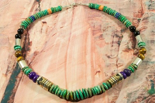 Genuine Assorted Gemstones Necklace with Sterling Silver and Gold Filled Barrels. Featuring Genuine Turquoise,Picture Jasper, and Blue Lapis. Sterling Silver Clasp. The photo is of the necklace you will be receiving. Stunning Necklace Created by Navajo Artist Tommy Singer. Signed.