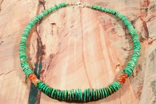 Stunning 5 Strand Genuine Gemstone Necklace. Genuine Sleeping Beauty Turquoise, Mohave Turquoise and Spiny Oyster Shell with Penshell Heishi Spacers. Each Gemstone Bead was hand drilled. Sterling Silver Cones, Clasp and Extender. Created by Santo Domingo Artist Lester Abeyta. The Santo Domingo Pueblo is in New Mexico, near Santa Fe. 
