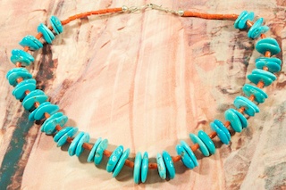 Beautiful Necklace featuring Genuine Sleeping Beauty Turquoise and Coral. Sterling Silver Clasp. Created by Santo Domingo Artist Paul Coriz. The Santo Domingo Pueblo is in New Mexico, near Santa Fe. 

