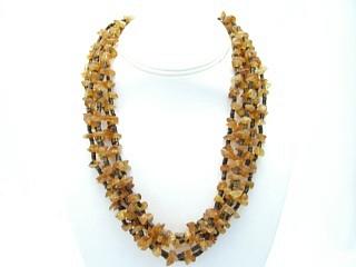 Beautiful 5 Strand Necklace featuring Genuine Amber and Penshell Heishi. Sterling Silver Cones and Clasp. Created by Santo Domingo Artist Carol Pacheco. The Santo Domingo Pueblo is in New Mexico, near Santa Fe. 
