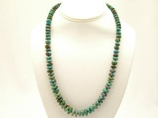 Genuine Nevada Turquoise and Penshell Heishi Necklace. Sterling Silver Beads and Clasp. The photo is of the jewelry you will be receiving. Created by Santo Domingo Artist Carol Pacheco. The Santo Domingo Pueblo is in New Mexico, near Santa Fe. 
