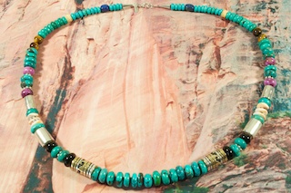 Stunning Necklace featuring Genuine Picture Jasper, Turquoise, Howlite, Blue Lapis and Coral. Sterling Silver Beads, Cones and Clasp. Created by Navajo Artist Tommy Singer. Signed.
