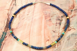 Stunning Necklace featuring Genuine Picture Jasper, Turquoise, Howlite, Black Onyx and Coral. Sterling Silver Beads, Cones and Clasp. Created by Navajo Artist Tommy Singer. Signed.