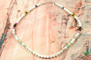 Genuine Assorted Gemstones Necklace. Featuring Genuine Turquoise, Spiny Oyster Shell and Coral. Sterling Silver Barrels, Beads and Clasp. Created by Navajo Artist Tommy Singer. Signed T. Singer.