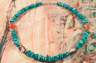 Beautiful Necklace featuring Genuine Turquoise and Spiny Oyster Shell. Sterling Silver Fluted Beads and Clasp. Created by Santo Domingo Artist Carol Pacheco. The Santo Domingo Pueblo is in New Mexico, near Santa Fe.