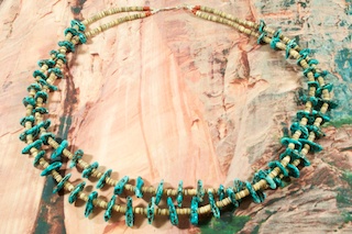 Beautiful 4 Strand Necklace featuring Genuine Kingman Turquoise and Penshell Heishi. Sterling Silver Cones and Clasp. Created by Santo Domingo Artist Carol Pacheco. The Santo Domingo Pueblo is in New Mexico, near Santa Fe. 