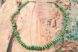 Stunning Necklace featuring Genuine Turquoise Rondelle Beads with Penshell Heishi. Sterling Silver Clasp. Created by Santo Domingo Artist Carol Pacheco. The Santo Domingo Pueblo is in New Mexico, near Santa Fe. 
