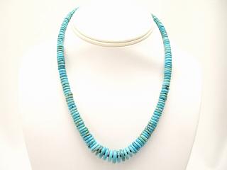 Stunning Necklace featuring Genuine Turquoise Rondelle Beads with Penshell Heishi. Sterling Silver Clasp. Created by Santo Domingo Artist Carol Pacheco. The Santo Domingo Pueblo is in New Mexico, near Santa Fe. 
