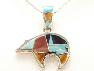 Genuine Sleeping Beauty Turquoise, Spiny Oyster Shell and Black Jade inlaid between ribbons of Sterling Silver. Beautiful inlay work on the bale of this Bear Design Pendant. Free 18