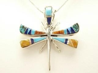 Genuine Turquoise, Spiny Oyster Shell and Blue Lapis inlaid between ribbons of Sterling Silver. Precision inlay on the bale and pendant. Free 18