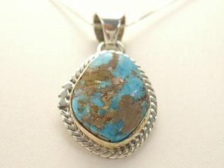 Genuine Candelaria Turquoise set in Sterling Silver Pendant. Created by Navajo Artist Tony Garcia. Signed. Free 18 inch Sterling Silver Chain with purchase of pendant. The Candelaria mine is located in Esmeralda County, Nevada.
