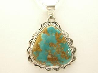 Genuine Crow Springs Turquoise set in Sterling Silver Pendant. Created by Navajo Artist Tsosie White. Signed. The Crow Springs Mine is located near Tonopah, Nevada. Free 18 inch Sterling Silver Chain with purchase.