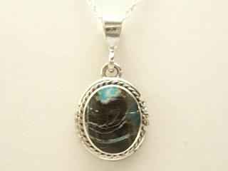 Genuine Sunnyside Turquoise set in Sterling Silver Pendant. Created by Navajo Artist Arkie Nelson. Signed. The matrix on this rare stone is outstanding. The Sunnyside mine is located in northern Nevada near the town of Tuscarora in the Tuscarora mountain range. Free 18 inch Sterling Silver Chain with purchase of pendant. 