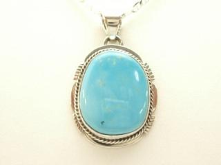 Genuine Manassa Turquoise set in Sterling Silver Pendant. This Turquoise is also referred to as King�s Manassa Turquoise. The Manassa Turquoise mine is located in Manassa, Conejos County, Colorado. Created by Navajo Artist Margaret Platero. Signed.