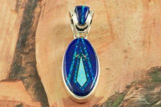 Genuine Kingman Spider Web Turquoise Stone set in Sterling Silver Pendant. Created by Navajo Artist Margaret Platero. Free 18 inch Sterling Silver Chain with purchase of pendant. The Kingman Turquoise Mine Is located near Kingman, Arizona.