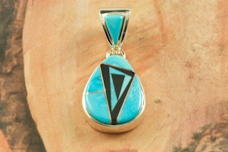 Beautiful Pendant featuring Genuine Sleeping Beauty Turquoise and Blue Lapis inlaid between ribbons of Sterling Silver. Free 18