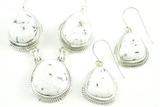 Genuine White Buffalo Turquoise set in Sterling Silver. This Beautiful Stone is formed from the minerals Calcite and Iron. It is mined near Tonopah Nevada. This Beautiful Pendant and Earring Set is a one of a kind Set. The photo is of the jewelry you will be receiving. The Pendant Created by Navajo Artist John Nelson and the Earrings are Created by Larson Lee. Free 18 inch Sterling Silver Chain with purchase. 
