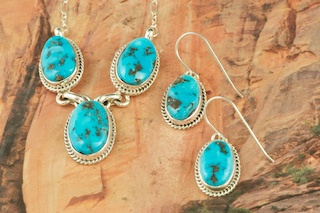 Genuine Sleeping Beauty Turquoise set in Sterling Silver. Beautiful Necklace and Earrings Set. The Sleeping Beauty Mine is located in Gila County, Arizona. The photo is of the jewelry you will be receiving. Created by Navajo Artist Lucy Valencia. Signed by the artist.
