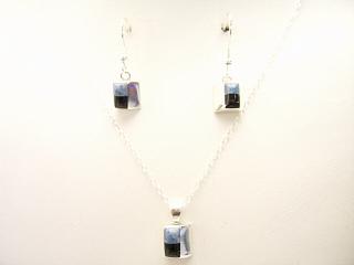 Genuine Denim Lapis and Black Jade inlaid in Sterling Silver. Free 18" Sterling Silver Chain. Beautiful French Wire Earrings and Pendant Created by Navajo Artist Ervin Nakai. Signed. Ervin Nakai is a Navajo Indian from Red Mesa, Arizona. He enjoys singing and playing his guitar at rodeos and church functions.
