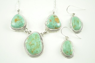 Genuine Number 8 Mine Turquoise Stones set in Sterling Silver. Beautiful Necklace and Earrings Set. Created by Navajo Artist Kathy Yazzie. Signed. The Number 8 mine is located in Eureka County Nevada. Since 1976 there has been no Number 8 Turquoise mined. There is however, an existing stock pile that Mr. Dowell Ward, the last owner of the Number 8 mine, had stocked away for later sorting. The Turquoise is a collector's item--because once the reserve is gone there will be no more material released onto the market. The Gold Mining Company owns the claim to the Number 8 mine and it has been swallowed up by the gold mining operations. This is some of the last Number 8 Turquoise to be had and will be a great addition to your collection. 