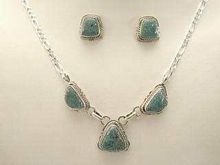 Authentic Native American Jewelry. Genuine Number 8 Mine Turquoise Stones set in Sterling Silver. Beautiful Necklace and Earring Set. Created by Navajo Artist Kathy Yazzie. Signed.

The Number 8 mine is located in Eureka County Nevada. Since 1976 there has been no Number 8 Turquoise mined. There is however, an existing stock pile that Mr. Dowell Ward, the last owner of the Number 8 mine, had stocked away for later sorting. The Turquoise is a collector's item--because once the reserve is gone there will be no more material released onto the market. The Gold Mining Company owns the claim to the Number 8 mine and it has been swallowed up by the gold mining operations. This is some of the last Number 8 Turquoise to be had and will be a great addition to your collection. 
