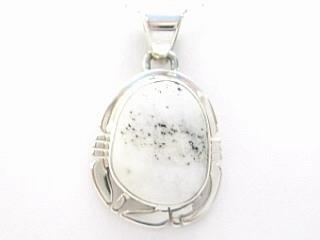Genuine White Buffalo Turquoise set in Sterling Silver. This Beautiful Stone is formed from the minerals Calcite and Iron. It is mined near Tonopah Nevada. This Beautiful Pendant and Earring Set is a one of a kind Set. The photo is of the jewelry you will be receiving. Created by Navajo Artists Bobby Piaso and Lucy Valencia. Signed. Free 18 inch Sterling Silver Chain with purchase. 
