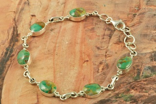 Genuine Nevada Green Tree Turquoise set in Sterling Silver Bracelet.  The Nevada Green Tree Mine is located in Lander County, Nevada.  Created by Navajo Artist Geneva Chavez. Signed by the artist. 