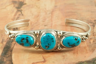 Genuine Sleeping Beauty Turquoise set in Sterling Silver Bracelet. The Sleeping Beauty Turquoise mine is located in Gila County, Arizona. Created by Navajo Artist Lucy Valencia. Signed L. J. by the artist.