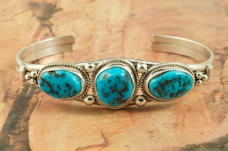 Genuine Sleeping Beauty Turquoise set in Sterling Silver Bracelet. The Sleeping Beauty Turquoise mine is located in Gila County, Arizona. Created by Navajo Artist Lucy Valencia. Signed L. J. by the artist.