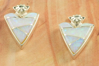 Stunning Fire and Ice Lab Opals inlaid between ribbons of Sterling Silver. Sterling Silver Post Earrings feature precision channel inlay. Designed by Navajo Artist Calvin Begay. Signed by the artist.