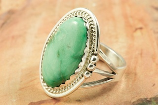 Genuine Royston Turquoise set in Sterling Silver Ring. The Royston Turquoise Mine was originally known as the Royal Blue Mine. It produces Turquoise that has a mixture of blues and greens in the same formation. The Royston Turquoise Mine is located in Nye County, Nevada. Created by Navajo Artist Justin Morris. Signed by the artist.
