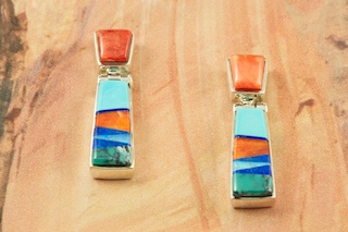 Genuine Turquoise, Spiny Oyster Shell and Blue Lapis inlaid in Sterling Silver. Beautiful Fire and Ice Lab Opal Accents. Post Earrings feature precision channel inlay. Designed by Navajo Artist Calvin Begay. Signed by the artist.