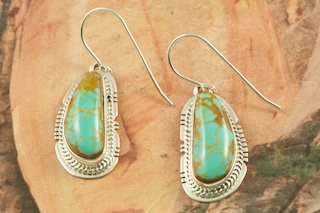 Genuine Manassa Turquoise set in Sterling Silver French Wire Earrings. This Turquoise is also referred to as King�s Manassa Turquoise. The Manassa Turquoise mine is located in Manassa, Conejos County, Colorado. Created by Navajo Artist Lucy Valencia. Signed L. J. by the artist.