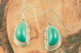 Genuine Manassa Turquoise set in Sterling Silver French Wire Earrings. This Turquoise is also referred to as King�s Manassa Turquoise. The Manassa Turquoise mine is located in Manassa, Conejos County, Colorado. Created by Navajo Artist Lucy Valencia. Signed L. J. by the artist.