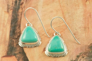 Genuine Manassa Turquoise set in Sterling Silver French Wire Earrings. This Turquoise is also referred to as King�s Manassa Turquoise. The Manassa Turquoise mine is located in Manassa, Conejos County, Colorado. Created by Navajo Artist Larson Lee. Signed by the artist.
