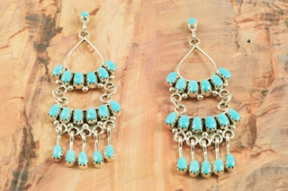 Stunning Earrings featuring Genuine Sleeping Beauty Turquoise set in Sterling Silver. Beautiful Post Earrings with Petit Point Design. The Sleeping Beauty Turquoise mine is located in Gila County, Arizona. Created by Zuni Artist Claudine Penketewa. Signed by the artist. The Zuni Pueblo is located in New Mexico, Land of Enchantment.