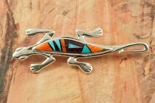 Beautiful Lizard Brooch featuring Genuine Turquoise, Spiny Oyster Shell and Black Jade inlaid in Sterling Silver. Accented with Fire and Ice Lab Opals. Designed by Navajo Artist Calvin Begay. Signed by the artist.