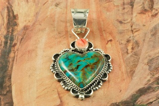 Genuine Turquoise Mountain Mine Turquoise and Spiny Oyster Shell set in Sterling Silver Pendant. The Turquoise Mountain Mine is located in the Mineral Park Mining District, Mohave County, Arizona. Although Turquoise Mountain is located near the Kingman Turquoise Mine it is considered a classic mine in its own right because the Turquoise is so different in appearance. It is also known as 